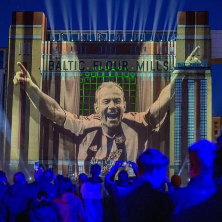 An image of Alan Shearer is projected onto the Baltic Flour Mill