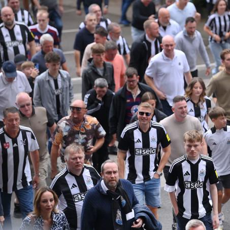 Fans walking stadium